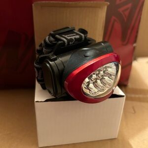 Head light with strap never used Great for cycling/running/camping/walking dog